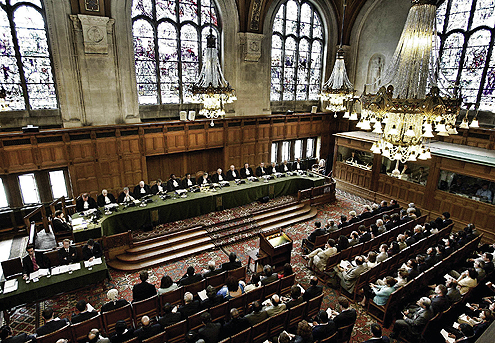 Judges attend a public sitting of the International Court of Justice at the Hague, the Netherlands in this July 9, 2004 file photo. The death of former Yugoslav president Slobodan Milosevic was a brief setback in what is otherwise a boom time for international justice and its capital, The Hague. Milosevic's death in custody deprived the UN tribunal for the former Yugoslavia (ICTY) of a verdict in the trial of its highest-profile suspect, but others should take place soon, including former Liberian leader Charles Taylor. To match feature Warcrimes-Hague Picture taken July 9, 2004. REUTERS/Paul Vreeker/Files