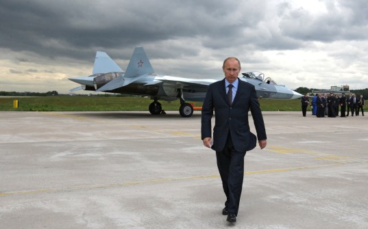 Men_Politics_Vladimir_Putin_against_a_fighter_023803_
