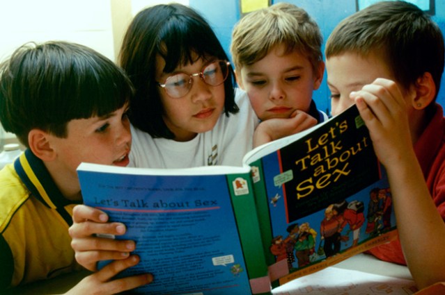 Sex education in primary school. 8 & 9 year olds reading Let's Talk About Sex book, London Borough of Greenwich UK. (Photo by: Photofusion/UIG via Getty Images)