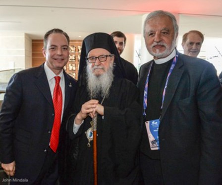 Рejнс Прибaс (слева) с архиепископом Димитриjем 