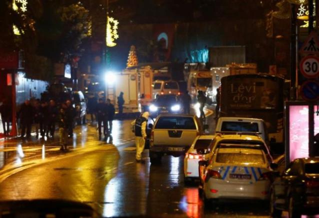 Police forensic experts examine an area near an Istanbul nightclub, following a gun attack